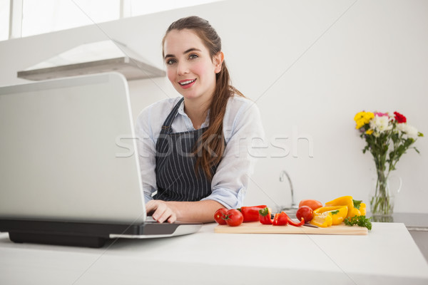 Pretty brunette following online recipe Stock photo © wavebreak_media