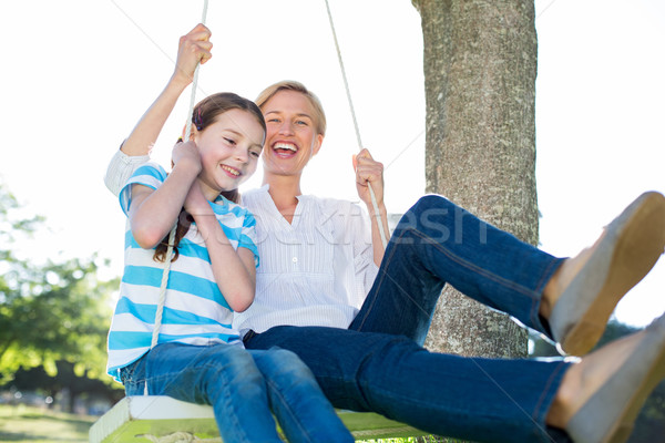 Happy blonde swing with her daughter Stock photo © wavebreak_media