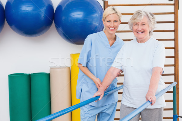 Senior woman and therapist smiling at camera  Stock photo © wavebreak_media