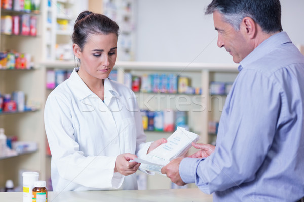 Customer handing a prescription to a trainee Stock photo © wavebreak_media
