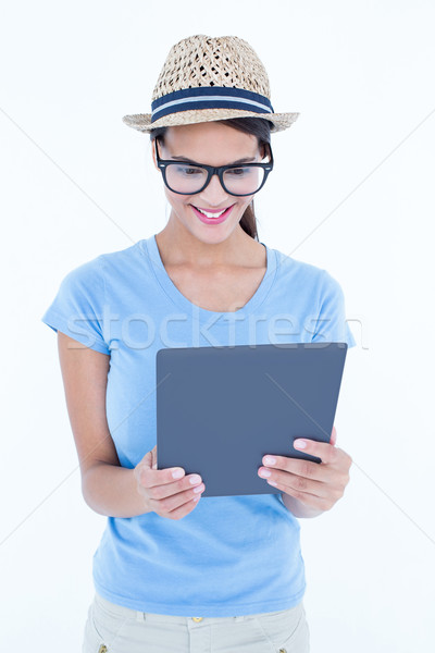 Smiling woman using her tablet  Stock photo © wavebreak_media
