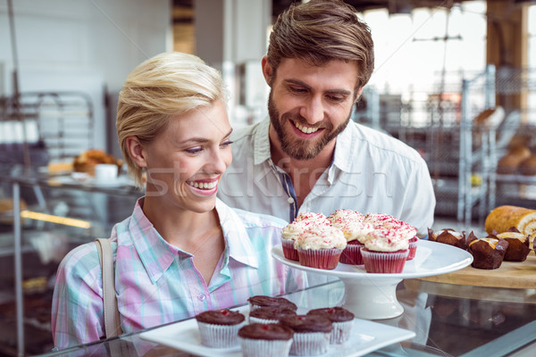 Cute couple date regarder gâteaux boulangerie [[stock_photo]] © wavebreak_media