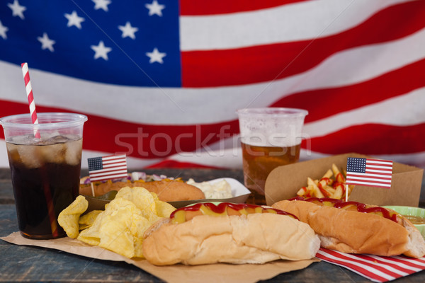 Drinks and snacks arranged on wooden table Stock photo © wavebreak_media