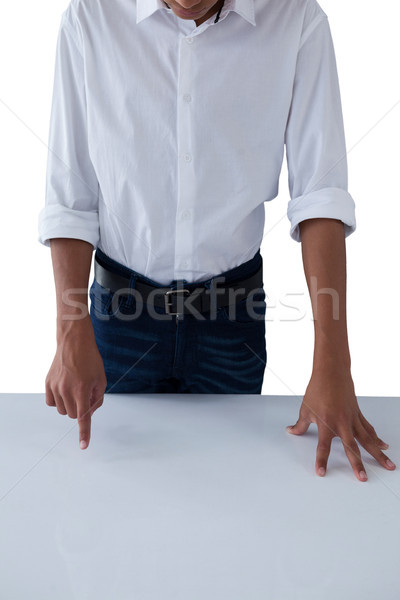 Teenage boy touching invisible screen on table Stock photo © wavebreak_media