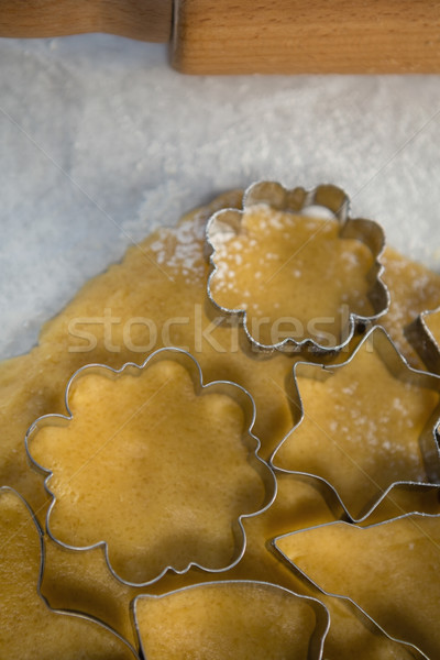 Various pastry cutters over dough on wax paper Stock photo © wavebreak_media