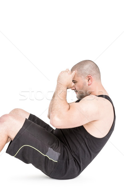 Stock photo: Athlete in sportswear doing crunches