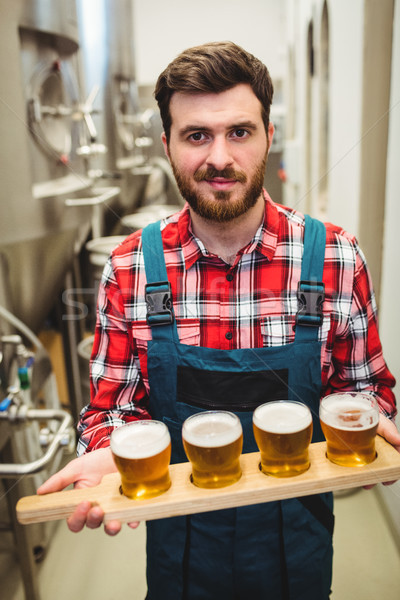 Manufacturer holding beer samples at distillery Stock photo © wavebreak_media