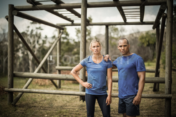 Fit woman and man standing against monkey bars during obstacle course Stock photo © wavebreak_media