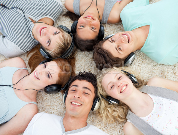 Group of teenagers listening to music  Stock photo © wavebreak_media