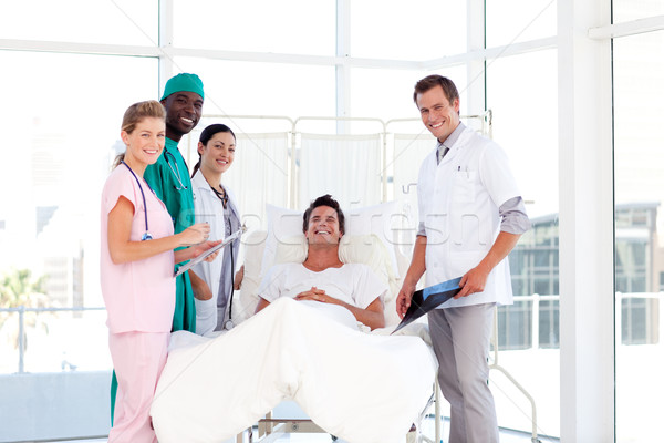 Stock photo: Consultation between doctors and a patient