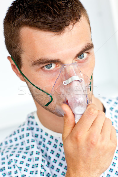 Patient having flu wearing a mask and looking at the camera Stock photo © wavebreak_media