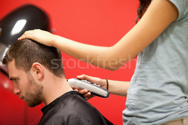 Male student having a haircut with a hair clippers Stock photo © wavebreak_media