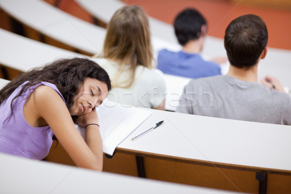 Young student sleeping during a lecture in an amphitheater Stock photo © wavebreak_media