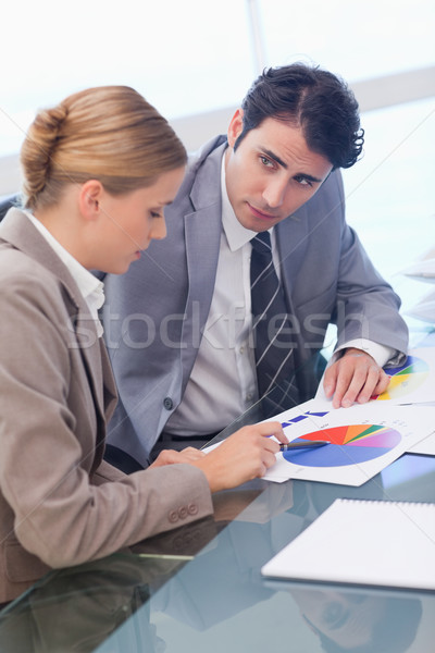 Portrait of young business people studying statistics in a meeting room Stock photo © wavebreak_media