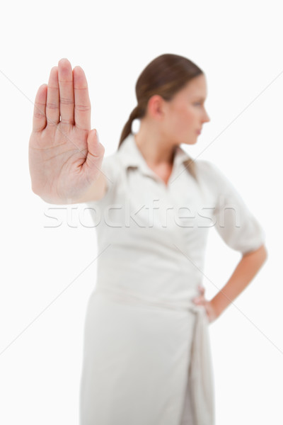 Portrait of a young businesswoman making a stop sign with the camera focus on her hand Stock photo © wavebreak_media