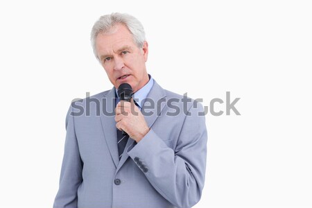 Mature tradesman speaking into microphone against a white background Stock photo © wavebreak_media