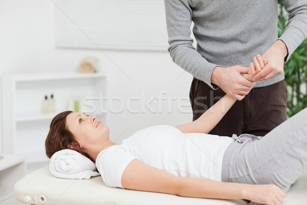 Physiotherapist massaging the hand of a woman in a physio room Stock photo © wavebreak_media