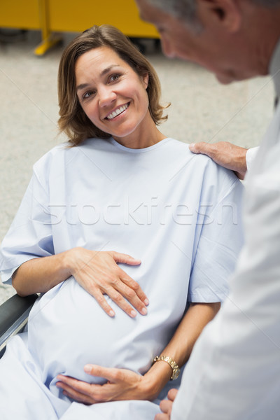 Smiling pregnant woman in wheelchair Stock photo © wavebreak_media