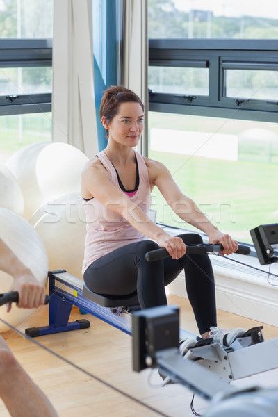 Woman rowing at the gym Stock photo © wavebreak_media