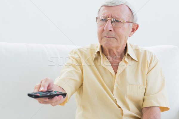 Ouderen man afstandsbediening sofa home woonkamer Stockfoto © wavebreak_media