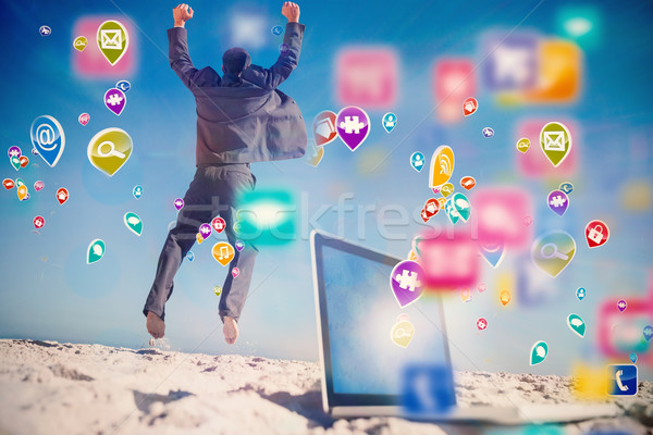 Composite image of victorious businessman jumping leaving his la Stock photo © wavebreak_media