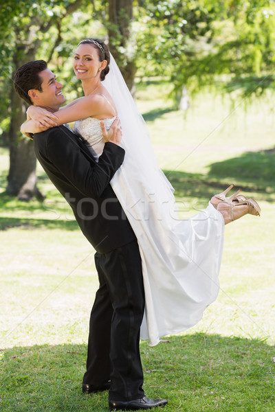 Side view groom lifting bride in garden Stock photo © wavebreak_media