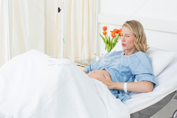 Woman suffering from labor pains Stock photo © wavebreak_media