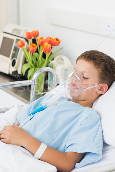 Boy wearing oxygen mask in hospital bed Stock photo © wavebreak_media