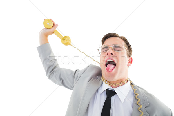 Geeky businessman being strangled by phone cord Stock photo © wavebreak_media