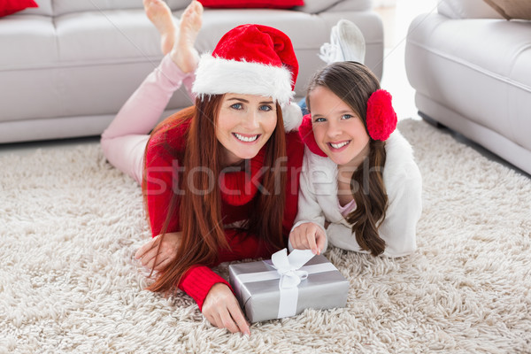 Festive mother and daughter smiling at camera Stock photo © wavebreak_media