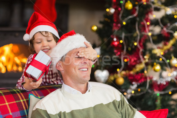 Fils surprenant père Noël cadeau maison [[stock_photo]] © wavebreak_media