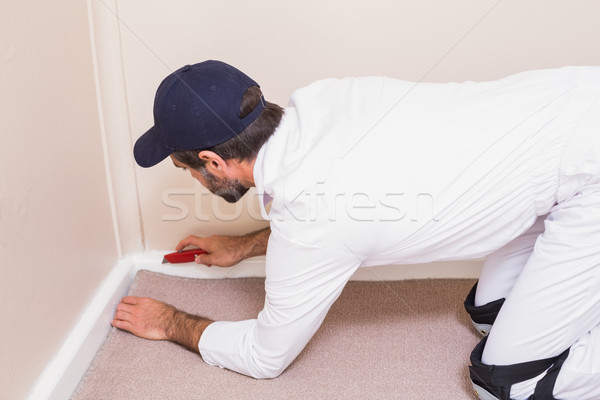 Handyman laying down a carpet Stock photo © wavebreak_media
