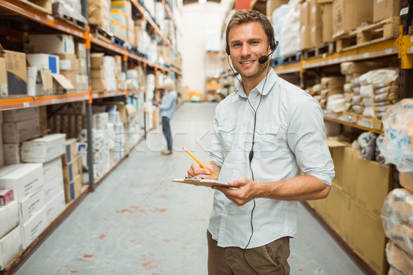 Stockfoto: Magazijn · manager · hoofdtelefoon · schrijven