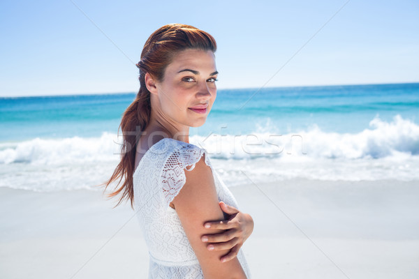 Pretty brunette standing arms outstretched  Stock photo © wavebreak_media