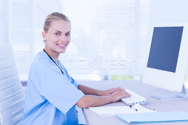 Happy doctor using computer  Stock photo © wavebreak_media