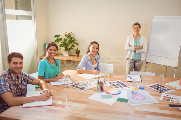 Femme d'affaires présentation collègues jeunes portable [[stock_photo]] © wavebreak_media