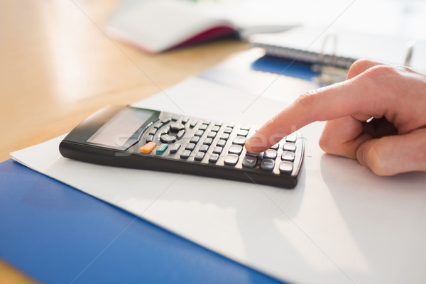 Businessman hands typing on calculator Stock photo © wavebreak_media