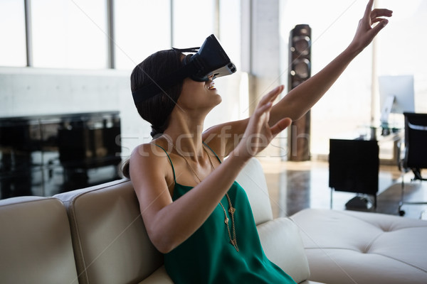 Woman using virtual reality simulator at office Stock photo © wavebreak_media