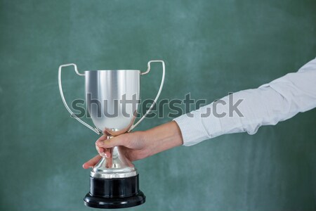 Mid section of female player with rugby ball and trophy Stock photo © wavebreak_media