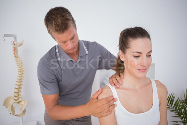 Doctor examining his patient arm Stock photo © wavebreak_media