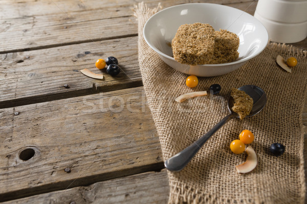 Granola bar and berry fruit on wooden table Stock photo © wavebreak_media