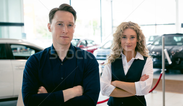 Portrait of entrepreneurs standing in car showroom Stock photo © wavebreak_media