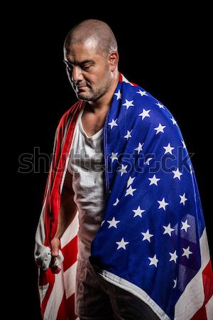 Athlete with american flag wrapped around his body Stock photo © wavebreak_media