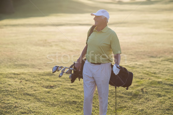 Stockfoto: Gelukkig · man · golftas · permanente · veld