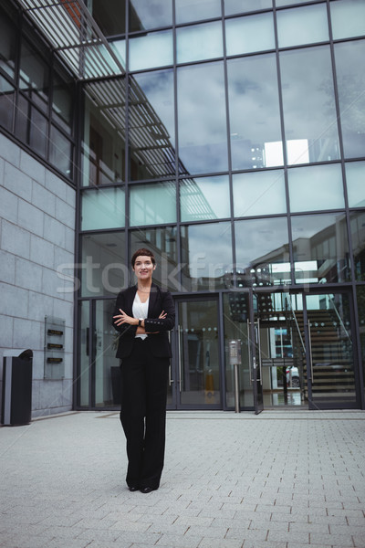 Smiling businesswoman standing in office premises Stock photo © wavebreak_media