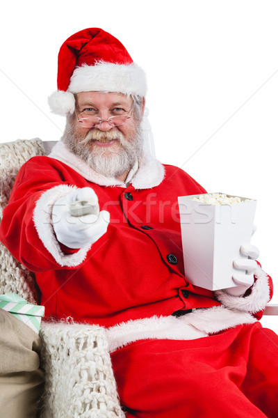 Santa claus having popcorn while watching tv Stock photo © wavebreak_media