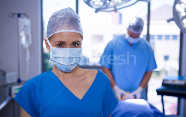 Portrait of female nurse wearing surgical mask in operation theater Stock photo © wavebreak_media
