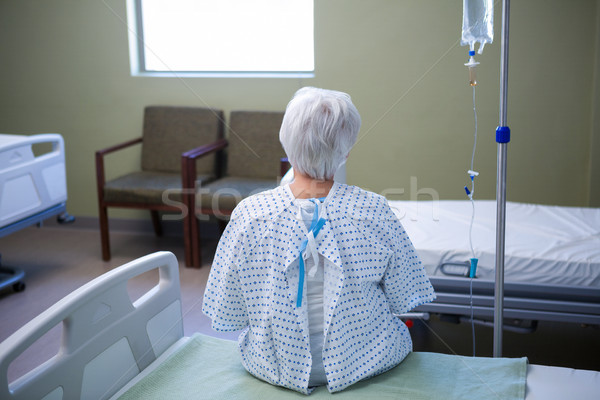 Stock photo: Rear-view of senior patient sitting on bed