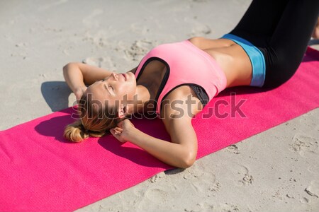 High angle view of young woman exercising on exercise mat Stock photo © wavebreak_media