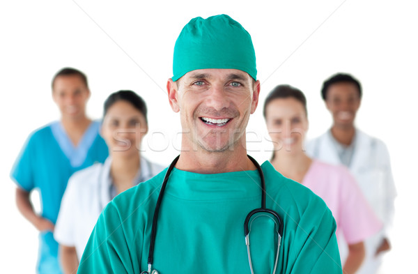 Smiling surgeon in front of his team Stock photo © wavebreak_media